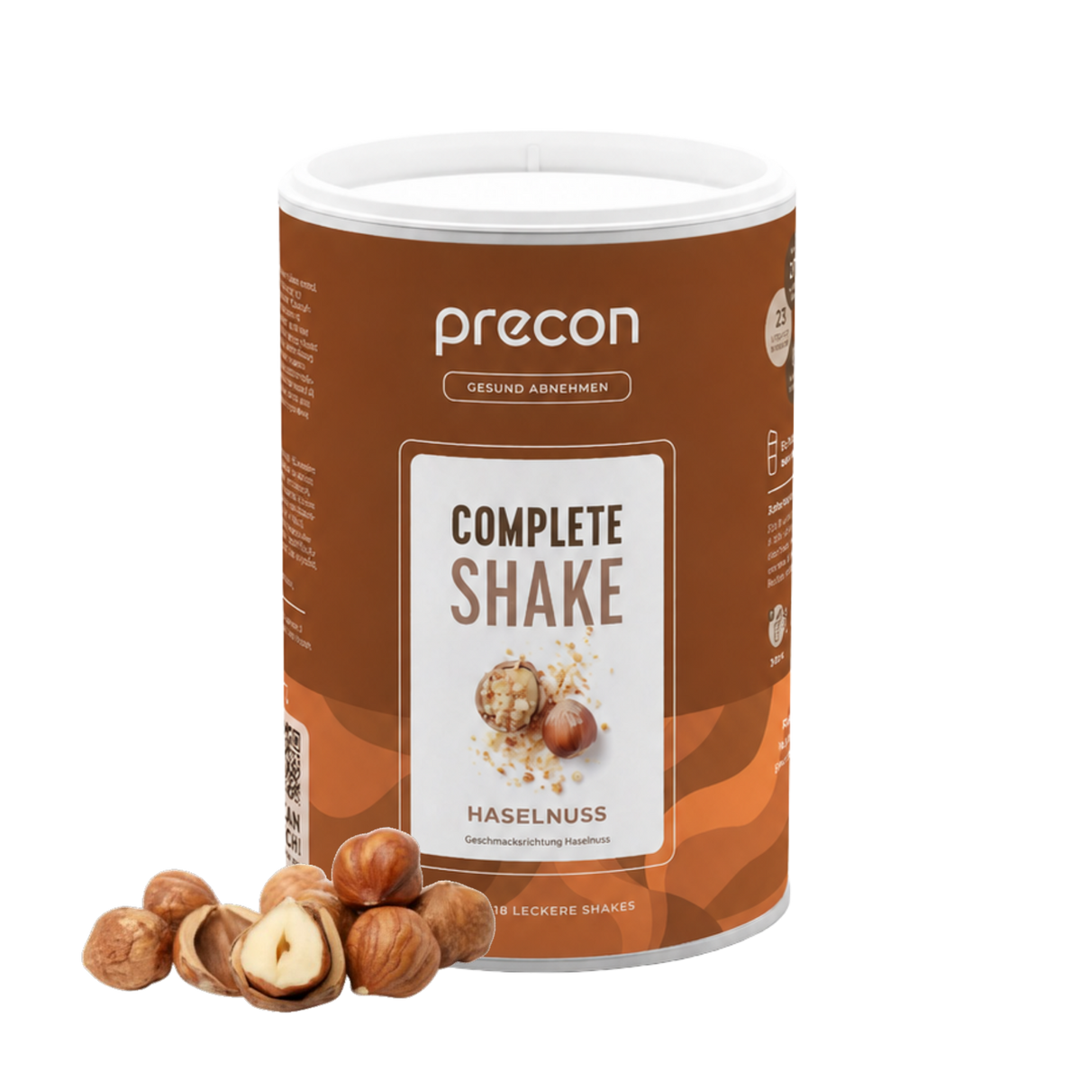 Ein Behälter mit „Anona GmbH Complete Shake Haselnuss“ steht aufrecht, davor sind auf weißem Hintergrund mehrere ganze und geschälte Haselnüsse angeordnet.